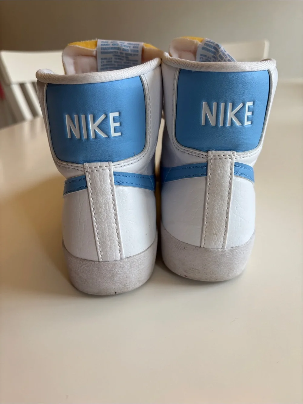 Nike Blazers Women’s High-Top Sneakers in White and Light Blue Swoosh